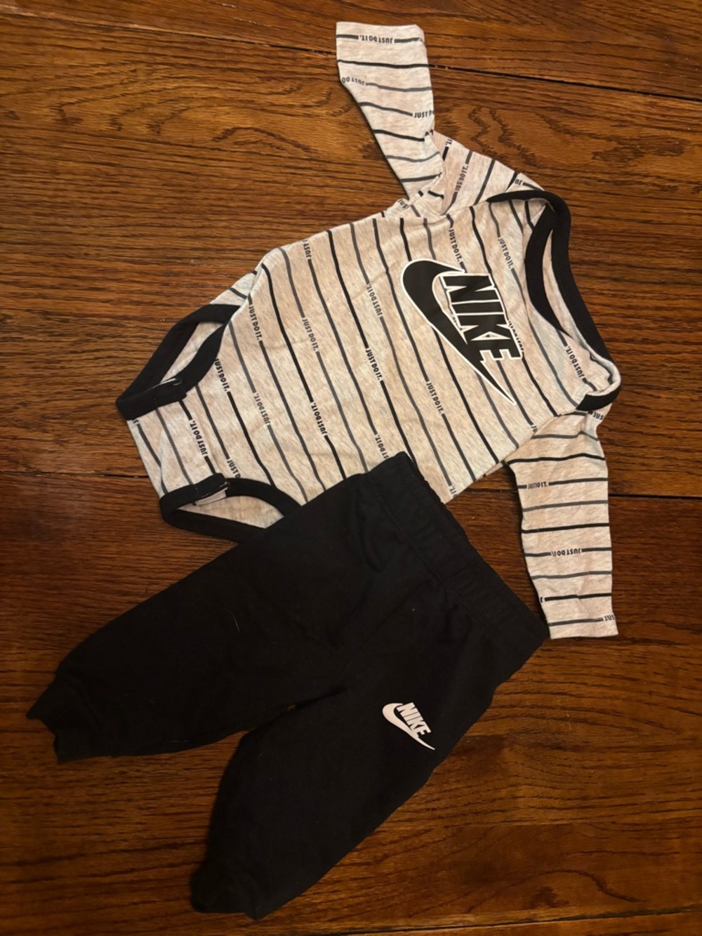 Nike Gray Heather Infant Bodysuit with Black Swoosh